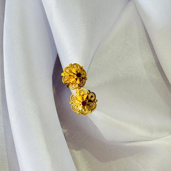 Gold plated flower stud earrings with small red stone for women